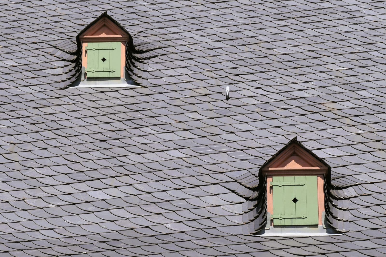 Natural slate roof with dormer windows on a period house